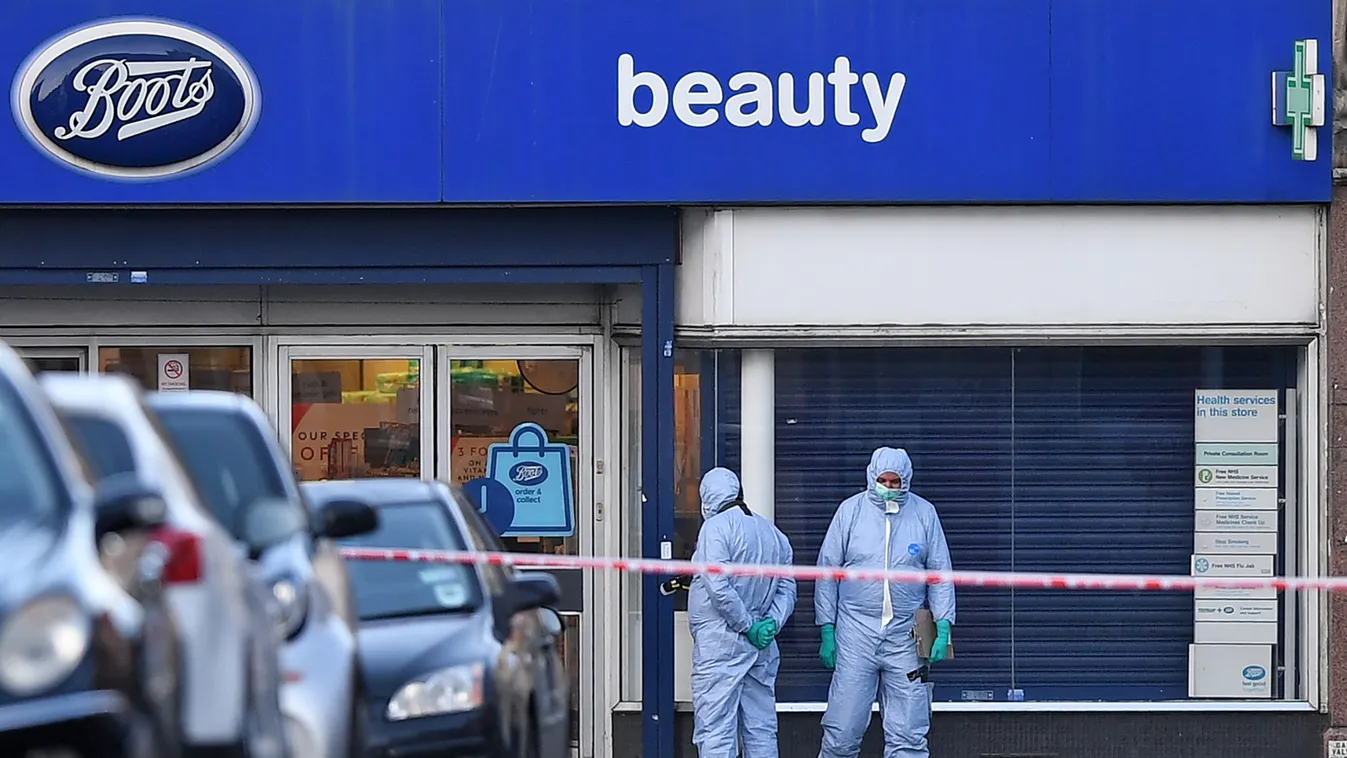 police Horizontal Police forensic officers work outside of a Boots store on Streatham High Road in south London on February 3, 2020, after a man was shot dead by police on February 2, following reports he had stabbed two people. - A man wearing a "hoax de