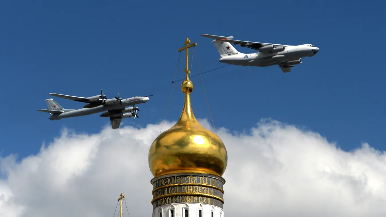 A Russian Il-78 aerial refueling tanker (R) and a Tu-95 strategic bomber fly above the Kremlin's cathedrals in Moscow, on May 5, 2015, during a rehearsal of the Victory Day parade. Russia will celebrate the 70th anniversary of the 1945 defeat of Nazi Germ