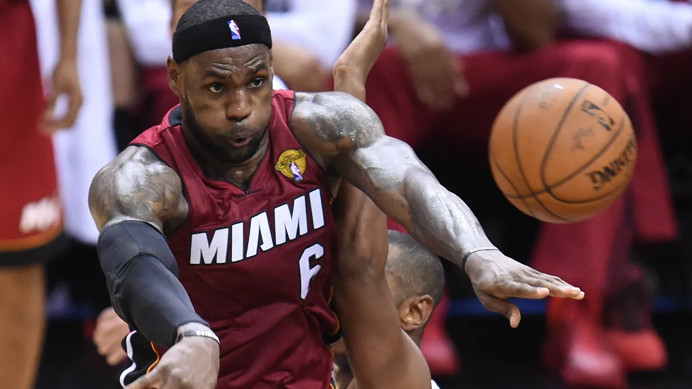 495643343 LeBron James of the Miami Heat passes the ball against the San Antonio Spurs during game 1 of the NBA Finals on June 5, 2014 in San Antonio,Texas. AFP PHOTO / Robyn Beck 