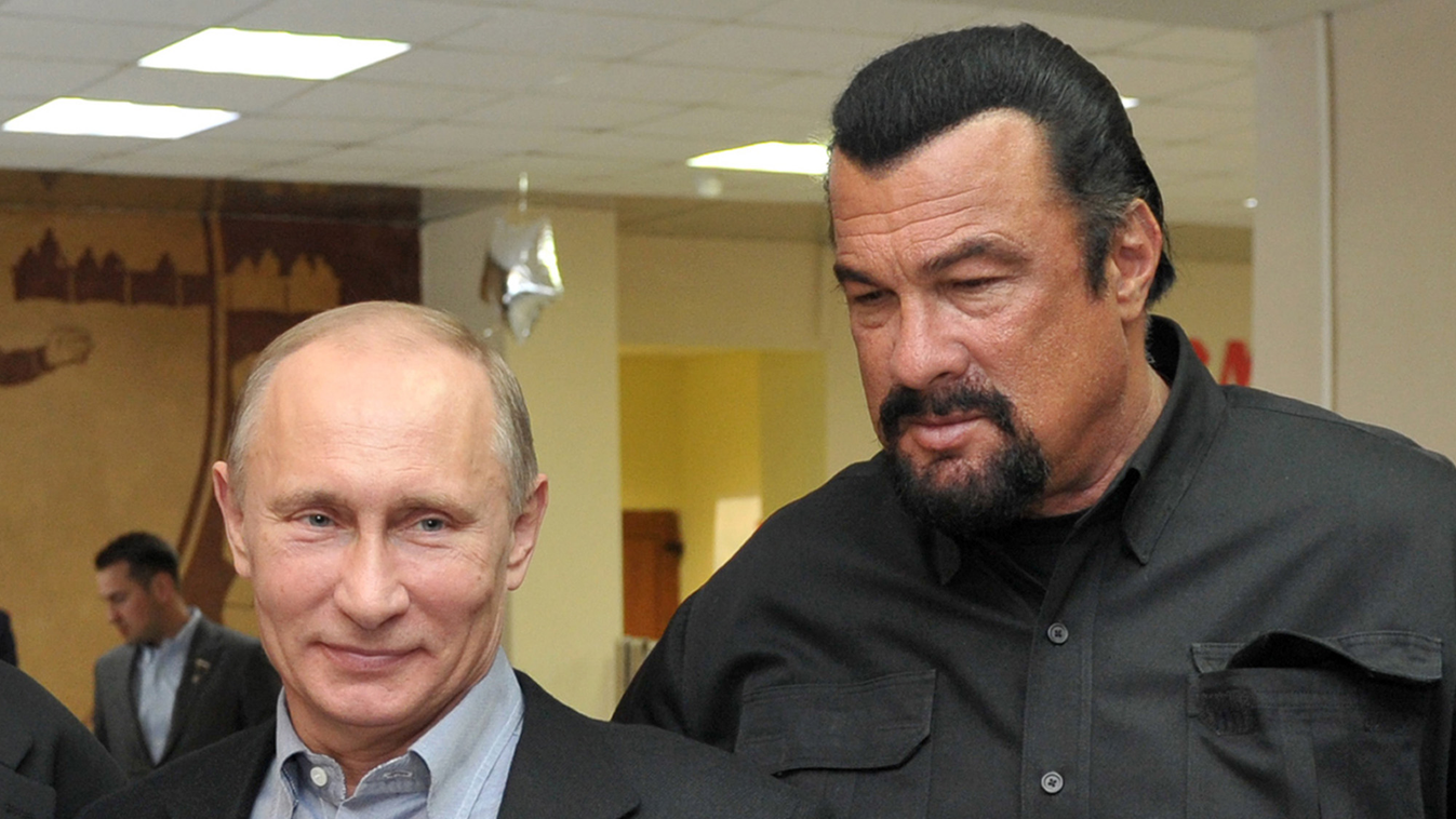 Horizontal (FILES) This photo taken on March 13, 2013 shows Russia's President Vladimir Putin and American action movie actor Steven Seagal visiting a newly-built sports complex of Sambo-70 prominent wrestling school in Moscow. Hollywood tough guy Steven 