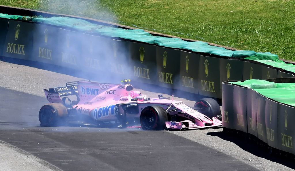 687715911 auto-f1 auto Horizontal Force India's French driver Esteban Ocon is forces to abandon after colliding and puncturing right after the start of the Brazilian Formula One Grand Prix, at the Interlagos circuit in Sao Paulo, Brazil, on November 12, 2