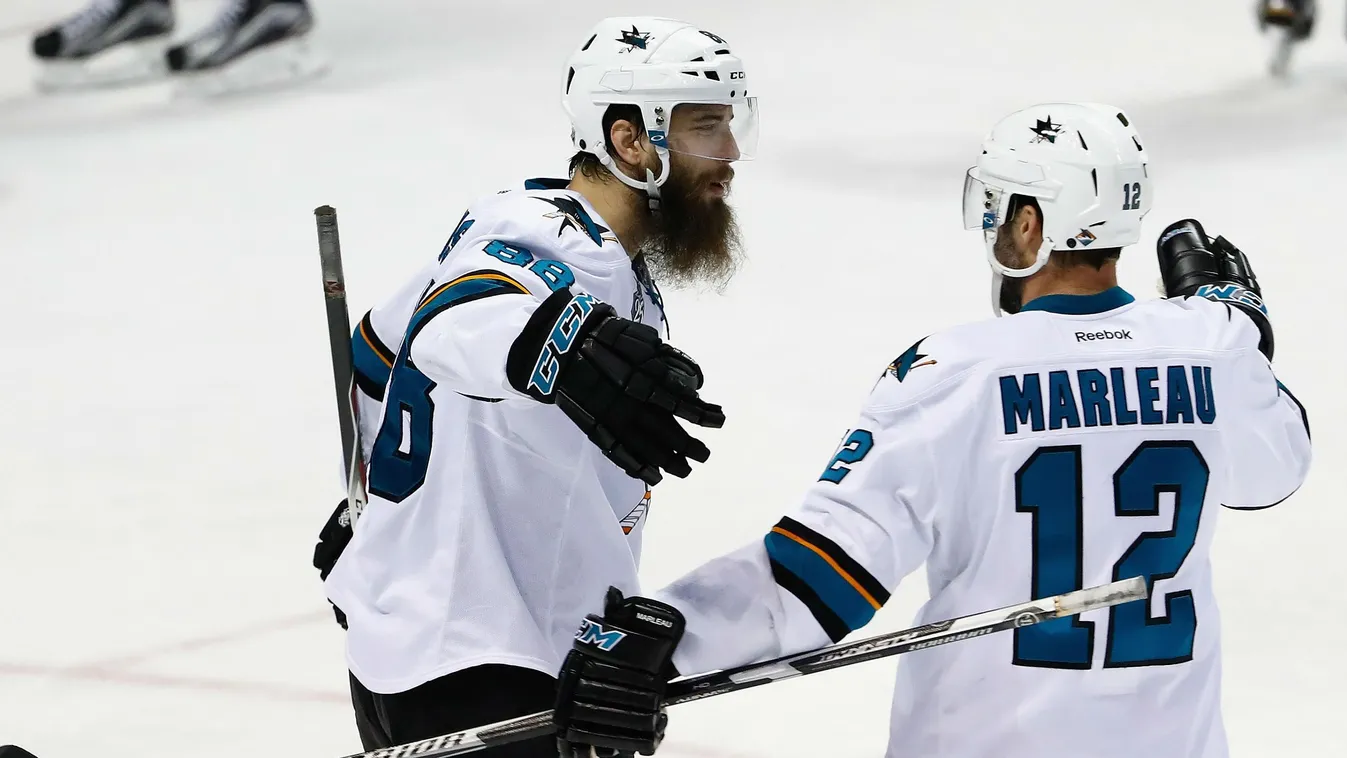 Brent Burns #88 of the San Jose Sharks celebrates with Patrick Marleau #12 after scoring a third period goal against Brian Elliott #1 of the St. Louis Blues 