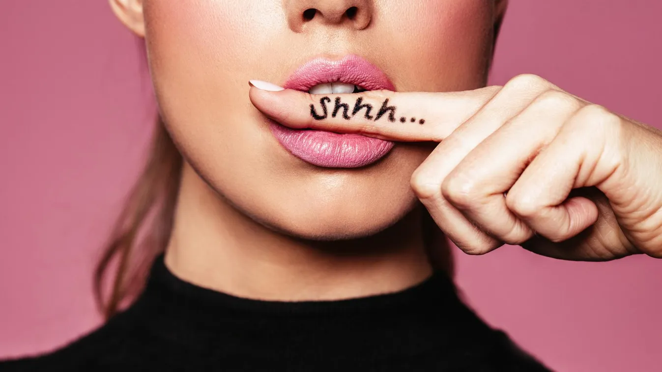 Shh! Women's secrets concept cropped focus girl lips make up makeup pastel pink quite sexy woman beautiful closeup written 