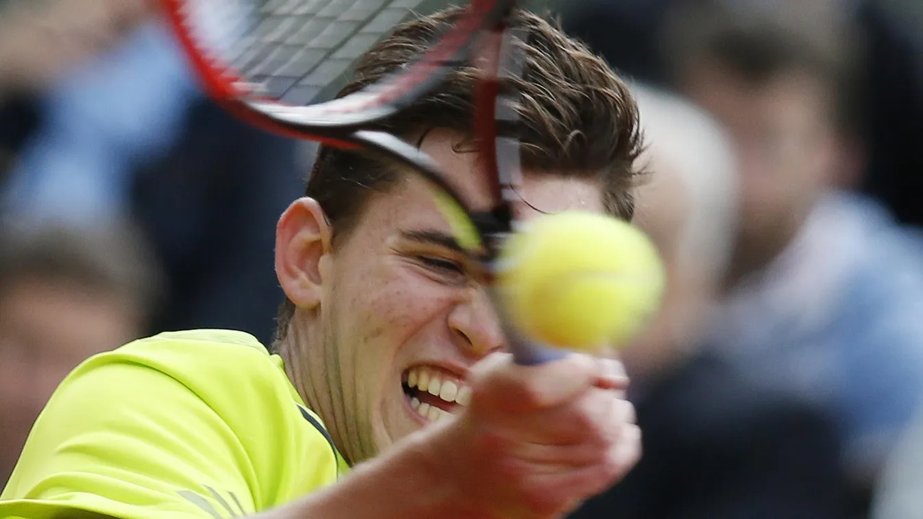 492605727 Austria's Dominic Thiem returns to Spain's Rafael Nadal during their French tennis Open second round match at the Roland Garros stadium in Paris on May 29, 2014. AFP PHOTO / PATRICK KOVARIK 