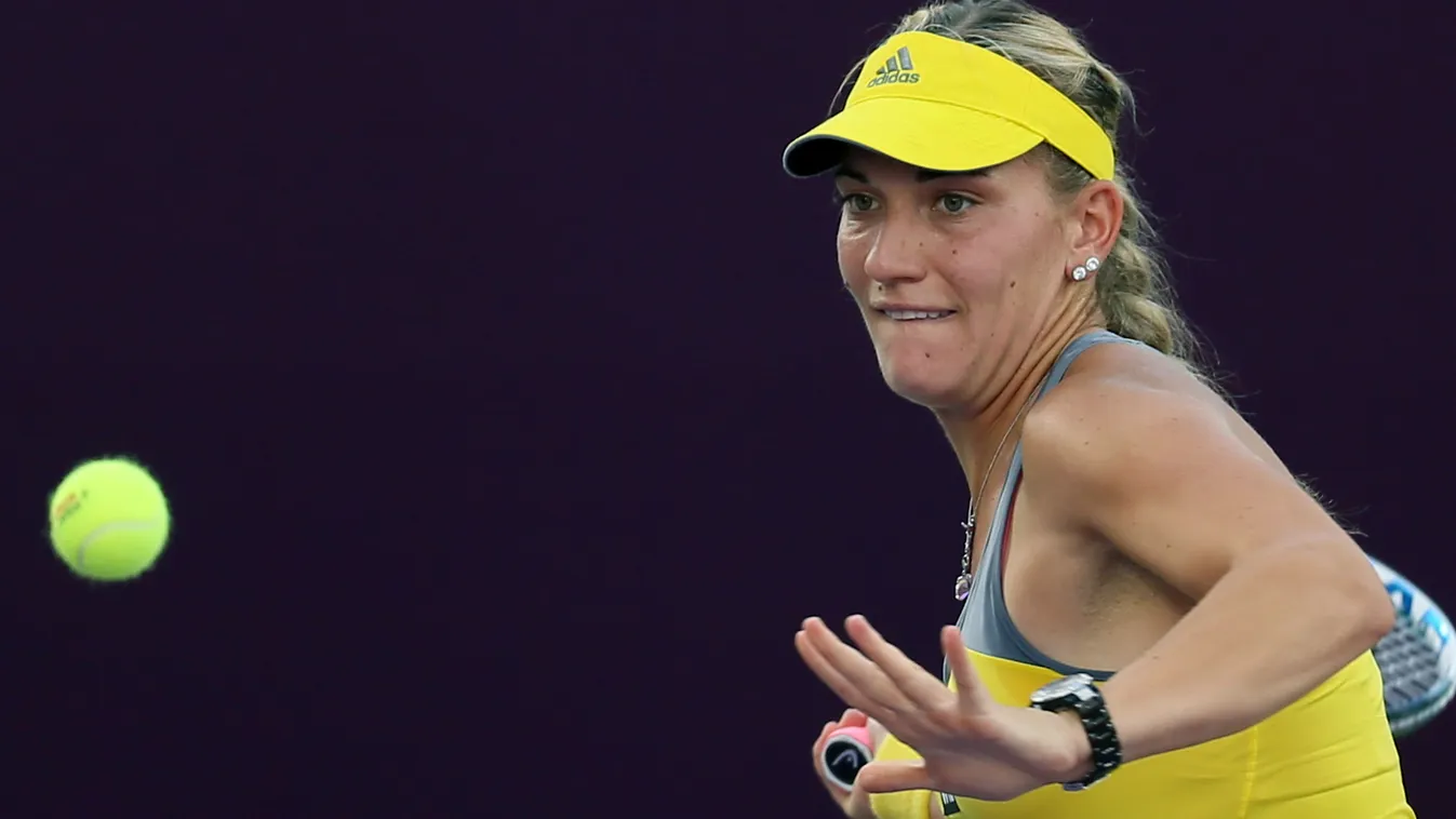 HORIZONTAL Timea Babos of Hungary returns the ball to Sara Errani of Italy during their WTA Qatar Open tennis match on February 13, 2013 in the capital Doha. AFP PHOTO / AL-WATAN DOHA / KARIM JAAFAR == QATAR OUT == 