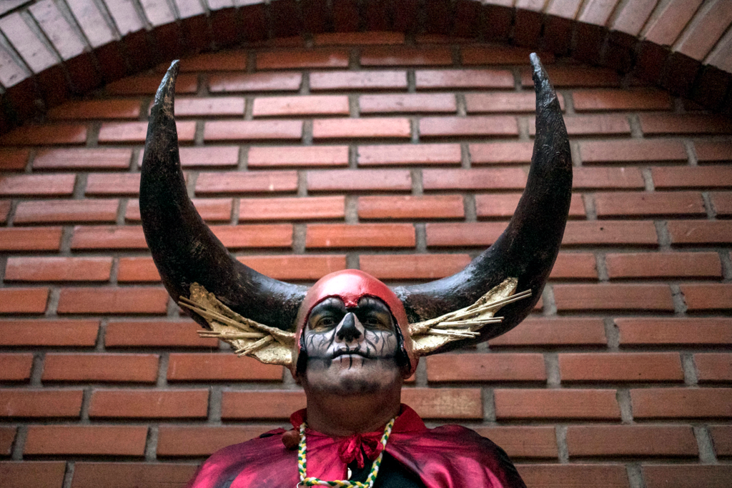 A man poses for a photo before the Devils parade at the Devils Carnival, in Riosucio, Caldas department, Colombia, on January 5, 2019. - The Devil's Carnival -which runs from January 4 to 9 and takes place every two years- has its origins in the 19th cent