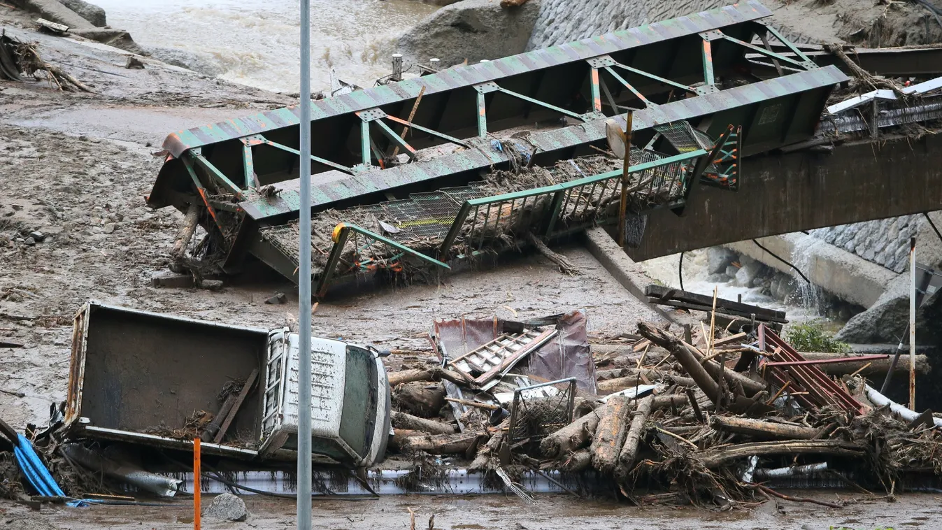 NATURAL DISASTERS CYCLONE DAMAGE HORIZONTAL A vehicle, debris and a bridge lie on the bed of the Nashizawa river at Nagiso town in Nagano prefecture, central Japan on July 10, 2014 following a mudslide. The landslide was caused by torrential rain on July 