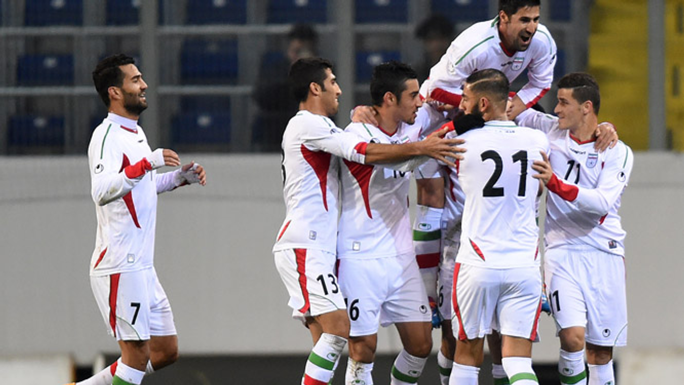 543455583 Iranian players celebrate their 1:0 goal during the friendly football match Iran vs Chile in St. Poelten, Austria on March 26, 2015. AFP PHOTO / JOE KLAMAR 