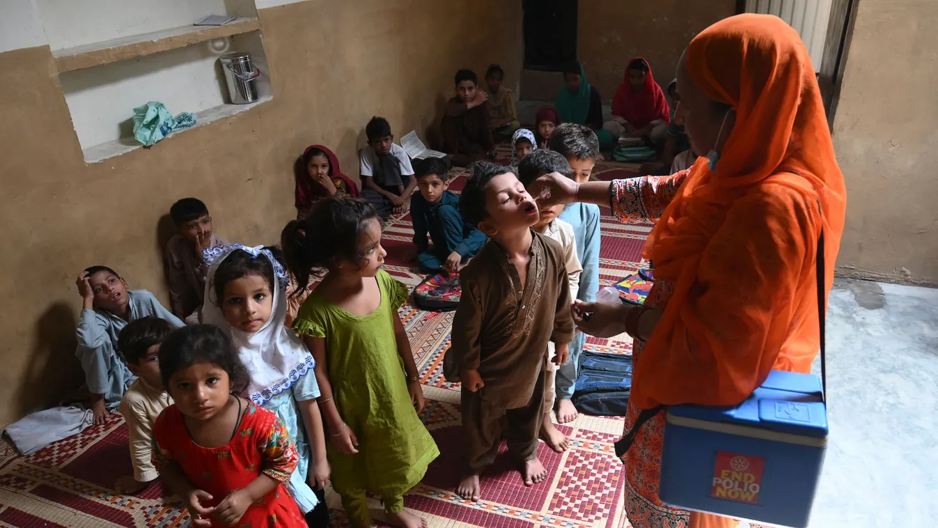 Horizontal POLIOMYELITIS HEALTH VACCINATION WOMAN CHILD VACCINATION CAMPAIGN 