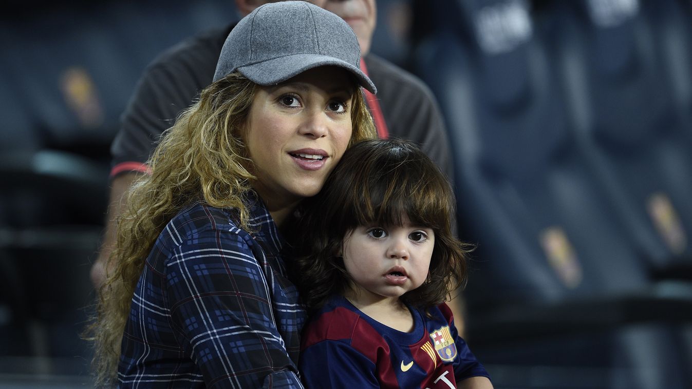 504075897 HORIZONTAL FOOTBALL WIFE SON PORTRAIT Colombian singer Shakira and her son Milan sit before the Spanish league football match FC Barcelona vs Eibar at the Camp Nou stadium in Barcelona on October 18, 2014.   AFP PHOTO/ LLUIS GENE 