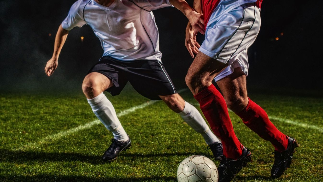 Soccer Players in Action Striker Black Background Real People Soccer Player Unrecognizable Person Soccer Ball Football - Ball Soccer Field Young Men Men Kick Off Sports Clothing Soccer Shoe Dribbling Taking A Shot - Sport Playing Running Kicking Defending