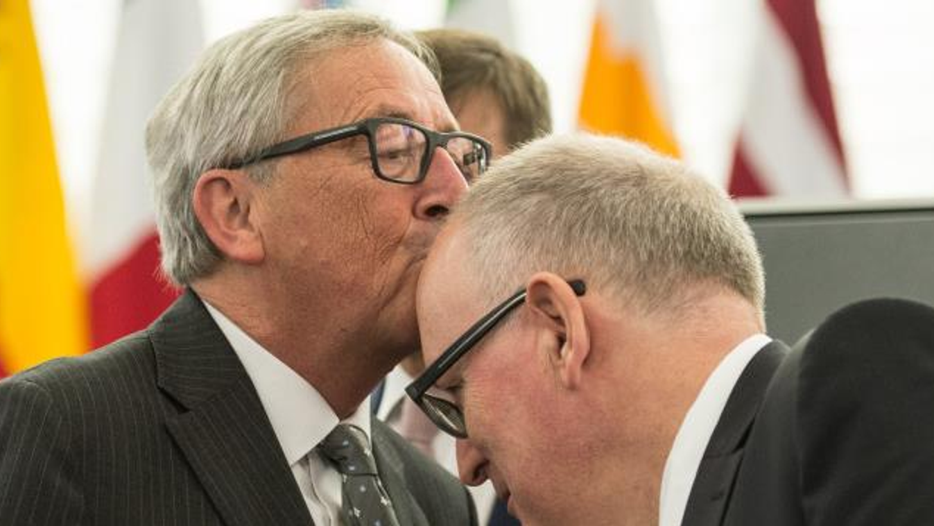European Parliament in Strasbourg epa04998134 Jean-Claude Juncker , President of the European Commission, kisses the head of First Vice-President of European Commission Frans Timmermans (R) of the Netherlands  before the key debate about the Conclusions o