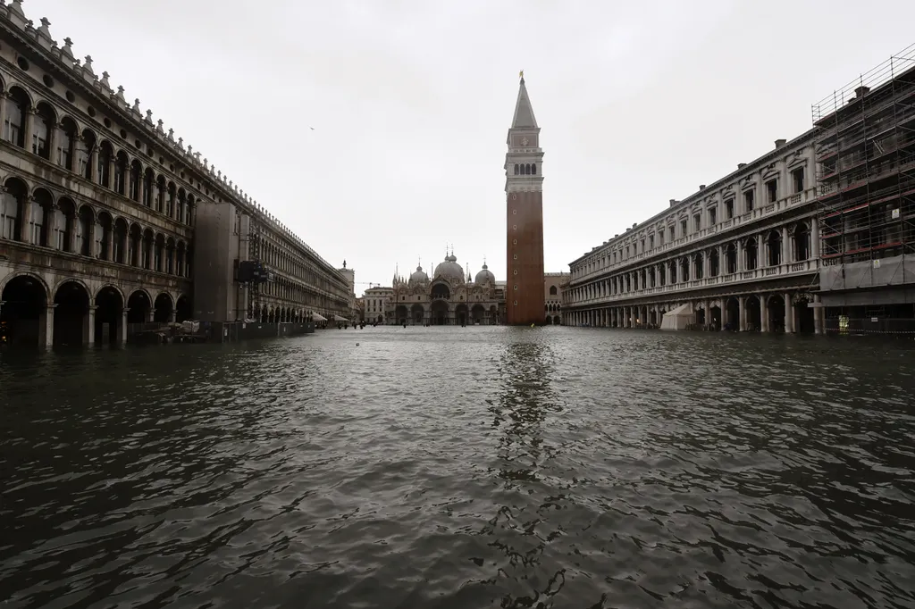 A picture taken on October 29, 2018 shows the flooded St. Mark's Square during a high-water (Acqua Alta) alert in Venice. - The flooding, caused by a convergence of high tides and a strong Sirocco wind, reached around 150 centimetres on October 29. (Photo