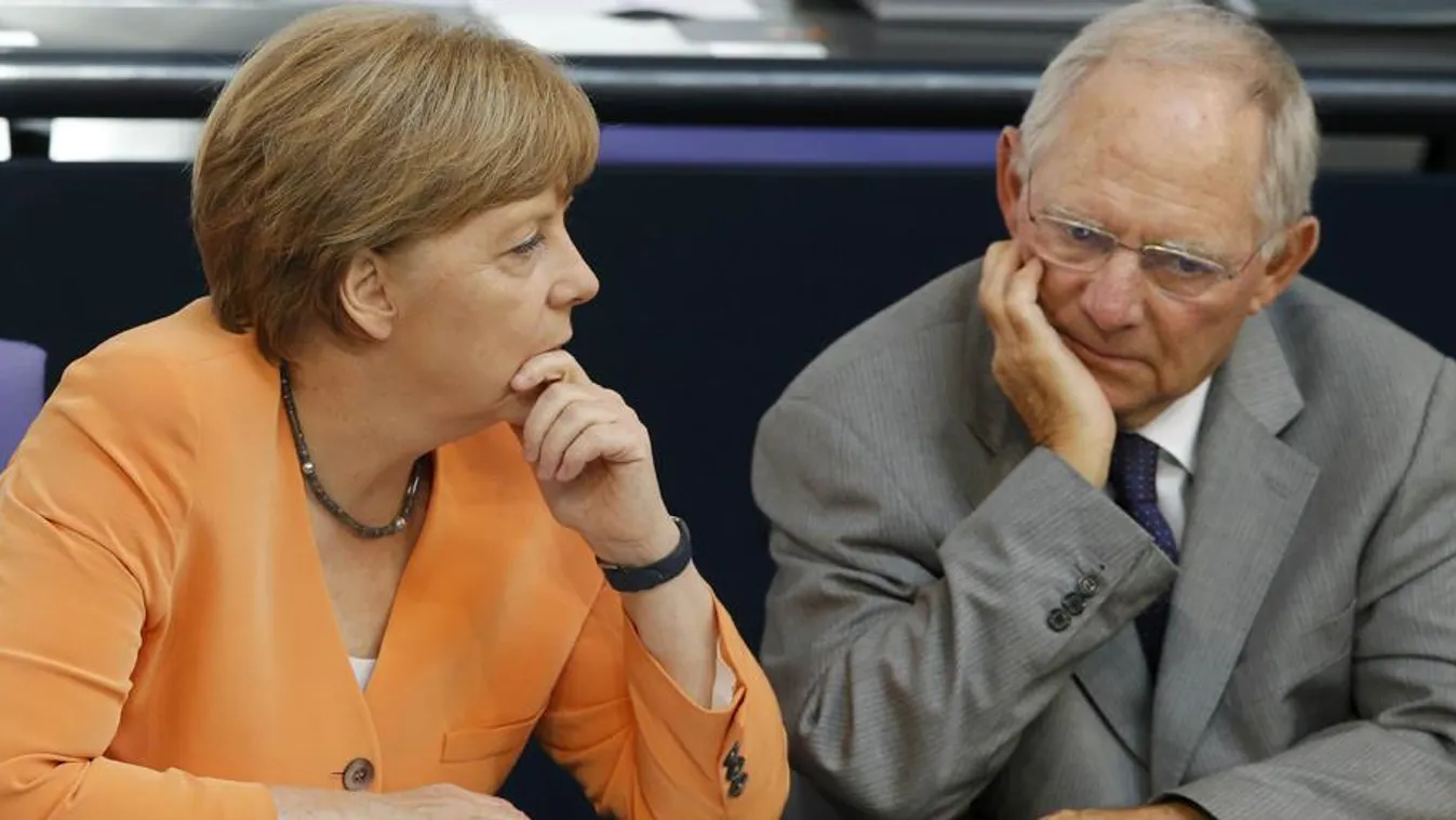 German Chancellor Merkel speaks with Finance Minister Schaeuble during a parliamentary debate on the Greek debt crisis at the German lower house of parliament Bundestag in Berlin :rel:d:bm:LR2EB710ZRP23 German Chancellor Angela Merkel speaks with Finance 