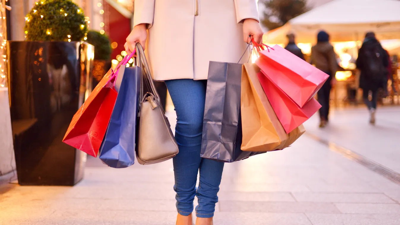 Shopping Vibrant Color Fashion Unrecognizable Person Photography Leggings One Woman Only Young Women Women Females City Life Shopaholic Gift Bag High Heels Paper Bag Christmas Lights Color Image Jeans Young Adult Shopping Buying Holding Carrying Customer 