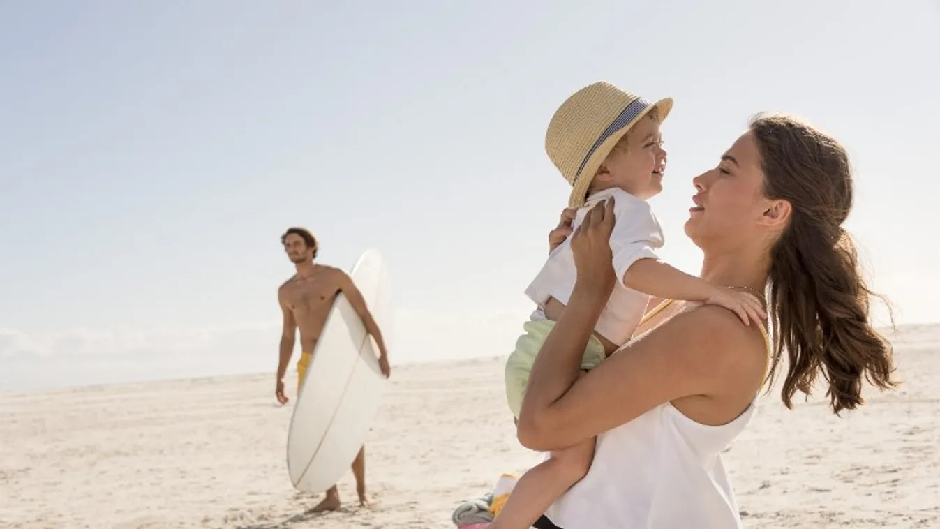Happy young family enjoying on beach Beach Family Father Mother Son Vacations 12-17 Months 18-19 Years 20-24 Years Baby Baby Boys Beach Holiday Bonding Casual Clothing Caucasian Appearance Child Childhood Color Image Content Cute Day Enjoyment Family With