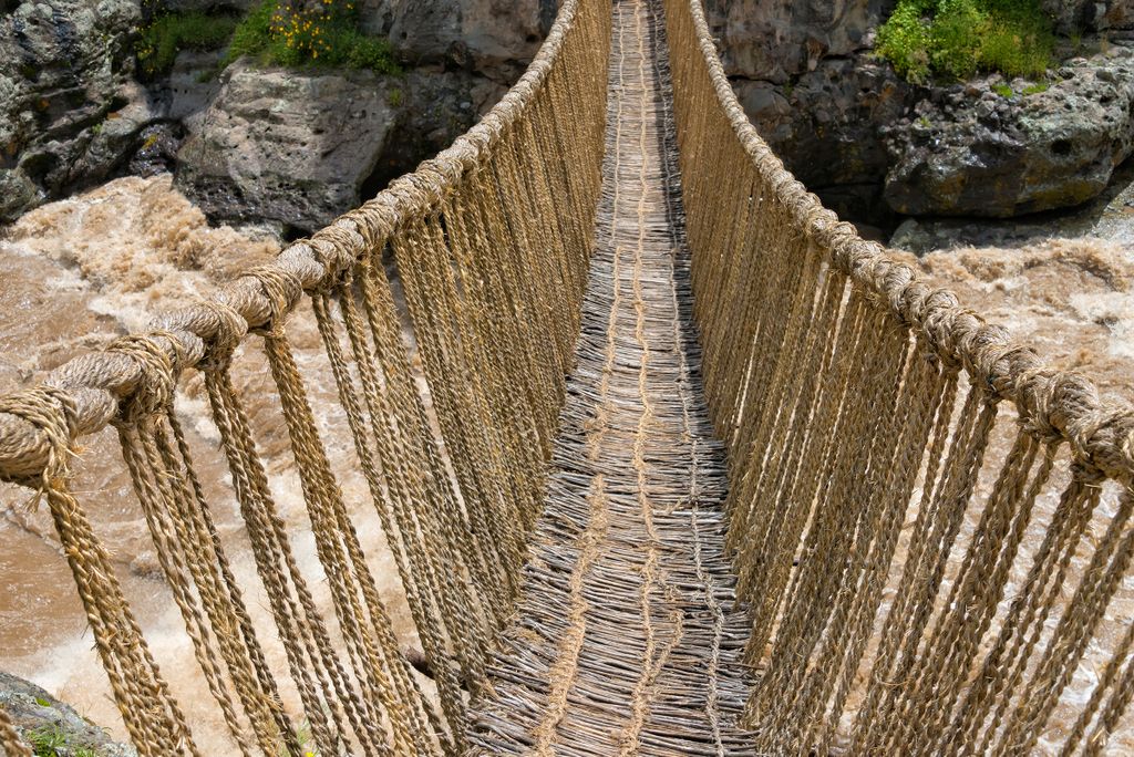 Queshuachaca,(q'eswachaka),Rope,Bridge,,One,Of,The,Last,Standing,Incan travel destination,quehue,rope,handwoven,peru,incan,horizontal,s Queshuachaca (Q'eswachaka) rope bridge, one of the last standing Incan handwoven bridges, Quehue, Canas Province, Peru 