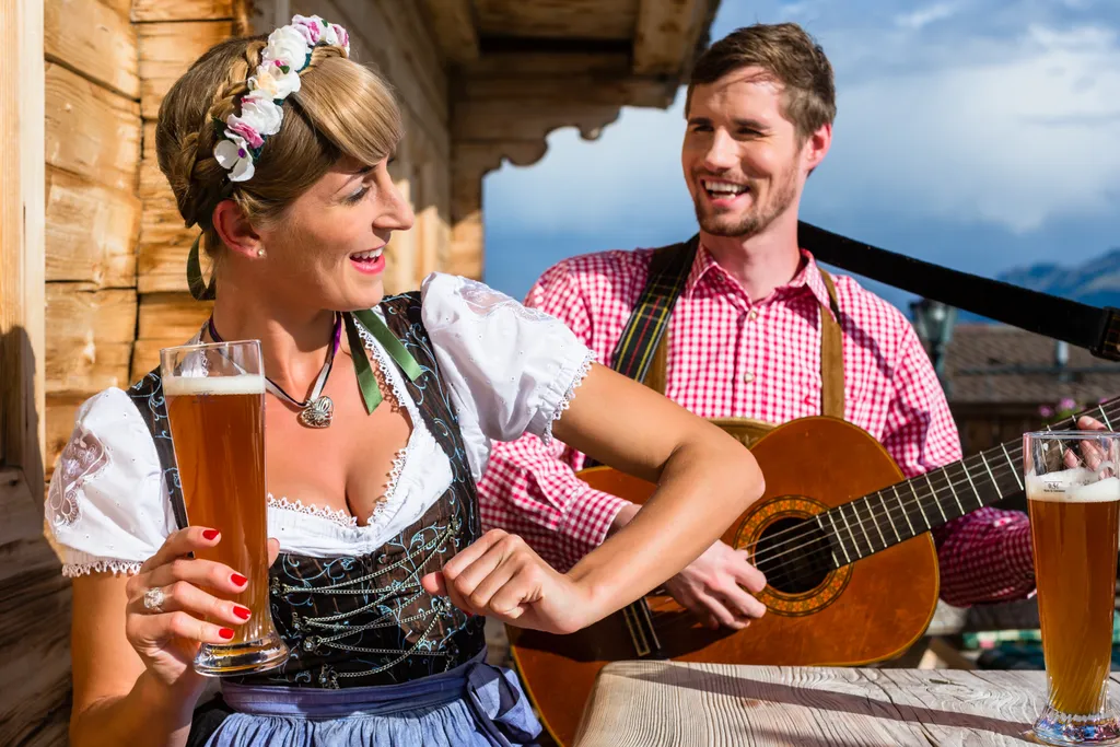 Couple,On,Mountain,Hut,In,The,Alps,Making,Guitar,Music 