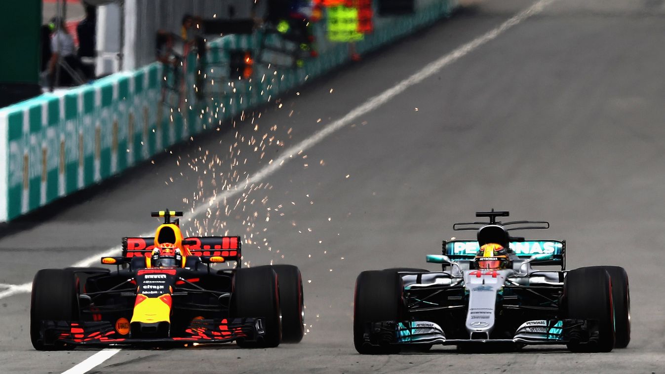 F1 Grand Prix of Malaysia P-20171001-00382 KUALA LUMPUR, MALAYSIA - OCTOBER 01: Max Verstappen of the Netherlands driving the (33) Red Bull Racing Red Bull-TAG Heuer RB13 TAG Heuer battles with Lewis Hamilton of Great Britain driving the (44) Mercedes AMG