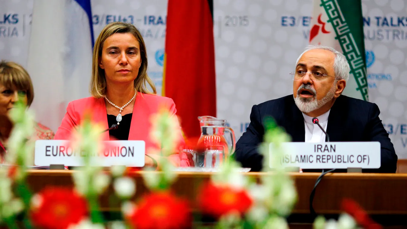Iranian Foreign Minister Mohammad Javad Zarif (R) speaks next to European Union High Representative for Foreign Affairs and Security Policy Federica Mogherini (C) during a plenary session at the United Nations building in Vienna, Austria July 14, 2015. Ir
