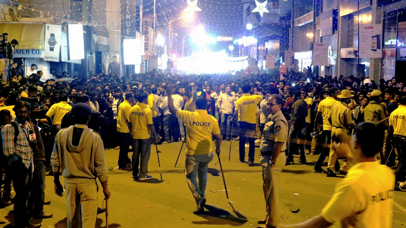 assault Horizontal (FILES) This file photograph taken on January 1, 2017, shows Indian police personnel holding 'lathi' sticks as they attempt to manage crowds during New Year's Eve celebrations in Bangalore.
There is "credible" evidence that gangs of men