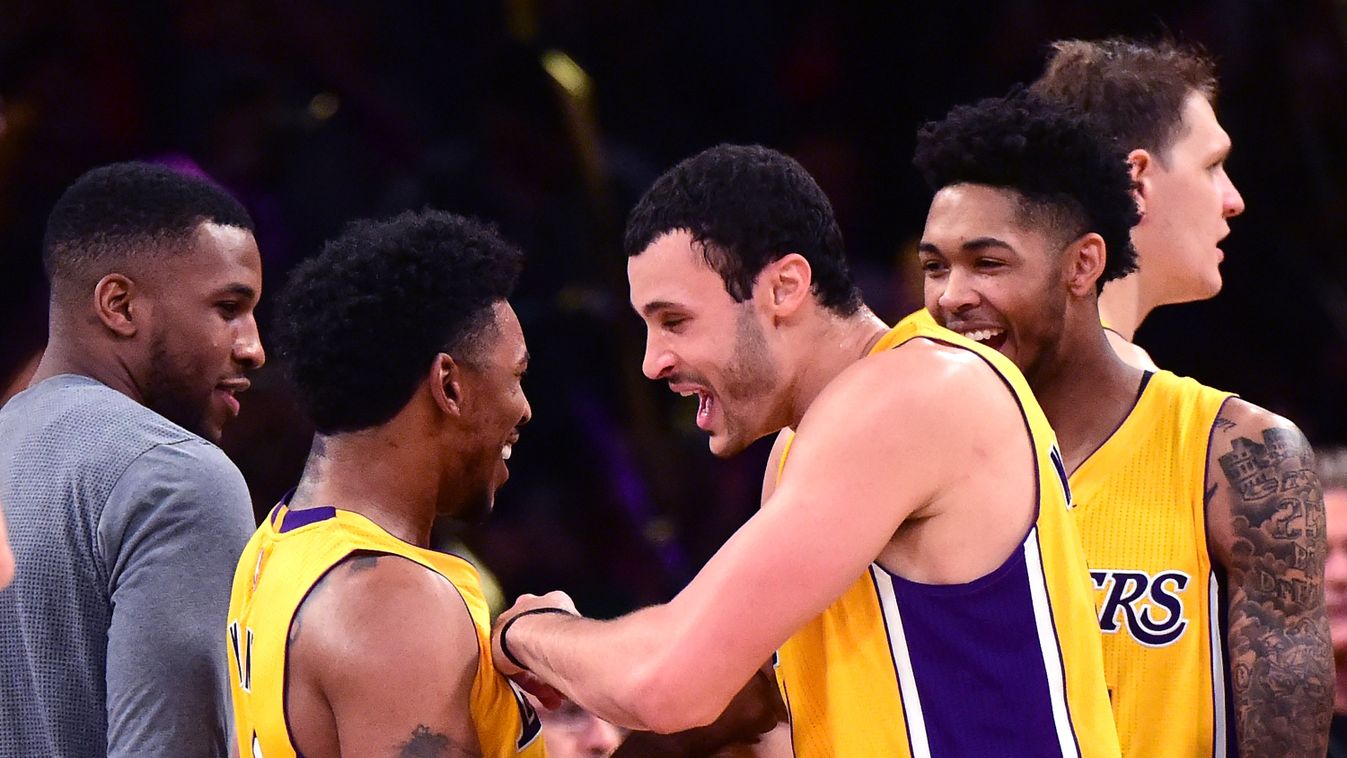 Nick Young #0 of the Los Angeles Lakers celebrates a 111-109 win over the Oklahoma City Thunder with Larry Nance Jr. #7, Brandon Ingram #14 and Tarik Black 