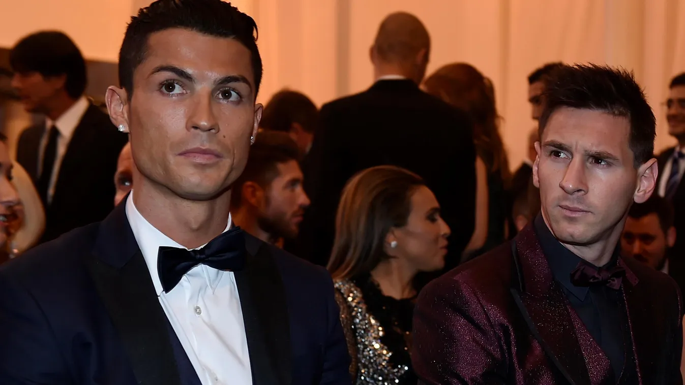 Horizontal Real Madrid and Portugal forward Cristiano Ronaldo (L) sits next to Barcelona and Argentina forward Lionel Messi and his wife Argentinian model Antonella Roccuzzo as they wait for the start of the 2014 FIFA Ballon d'Or award ceremony at the Kon