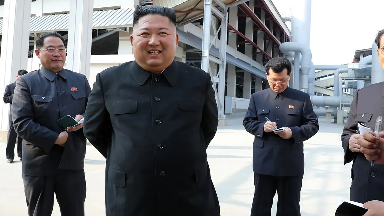 TOPSHOTS Horizontal SMILING This picture taken on May 1, 2020 and released from North Korea's official Korean Central News Agency (KCNA) on May 2, 2020 shows North Korean leader Kim Jong Un (2nd L) visiting the completed Suchon phosphate fertilizer factor