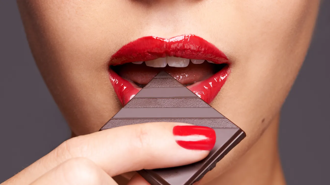 Indulging in a sweet affair with chocolate Addiction Adult Adults Only Backgrounds Beautiful Beauty Product Black Background Candy Caucasian Chocolate Chocolate Candy Close-up Color Image Colors Content Desire Eating Elegance Expressing Positivity Fashion