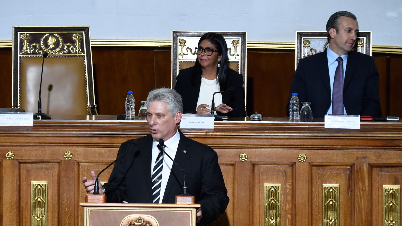 diplomacy government Horizontal Cuban President Miguel Diaz-Canel delivers a speech before the Constituent Assembly, as its president Delcy Rodriguez (back, L) and Venezuelan Vice-President Tareck El Aissami listen, in Caracas on May 30, 2018.
Diaz-Canel 