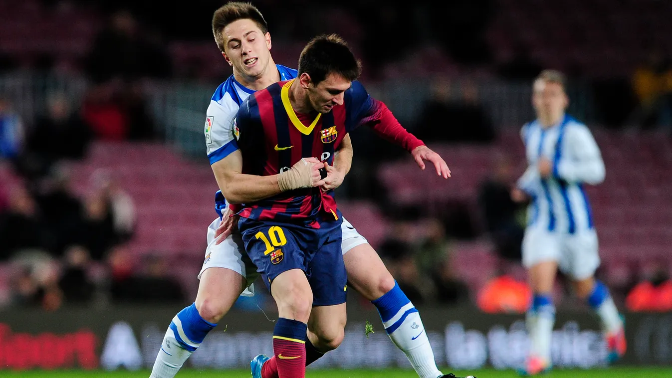 - Real Sociedad's defender Jon Gaztanaga (L) vies with Barcelona's Argentinian forward Lionel Messi  (R) during the Spanish Copa del Rey (King's Cup) FC Barcelona vs Real Sociedad semi-final match at the Camp Nou stadium in Barcelona on February 5, 2014. 