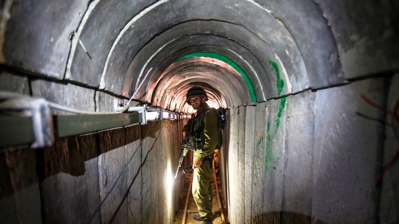 MIDDLE EAST ISRAEL-PALESTINE WAR HORIZONTAL MILITARY OPERATION TRANSPORT TUNNEL SOLDIER INTERIOR VIEW ISRAELI TOPSHOTS
-- AFP PICTURES OF THE YEAR 2014 --
An Israeli army officer walks on July 25, 2014 during an army-organised tour in a tunnel said to be 