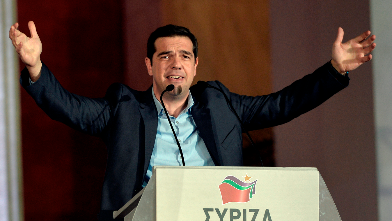 Syriza leader Alexis Tsipras greets supporters following victory in the election in Athens on January 25, 2015. Greek Prime Minister Antonis Samaras said the nation "had spoken" in handing victory to the anti-austerity Syriza party, and said he hoped the 