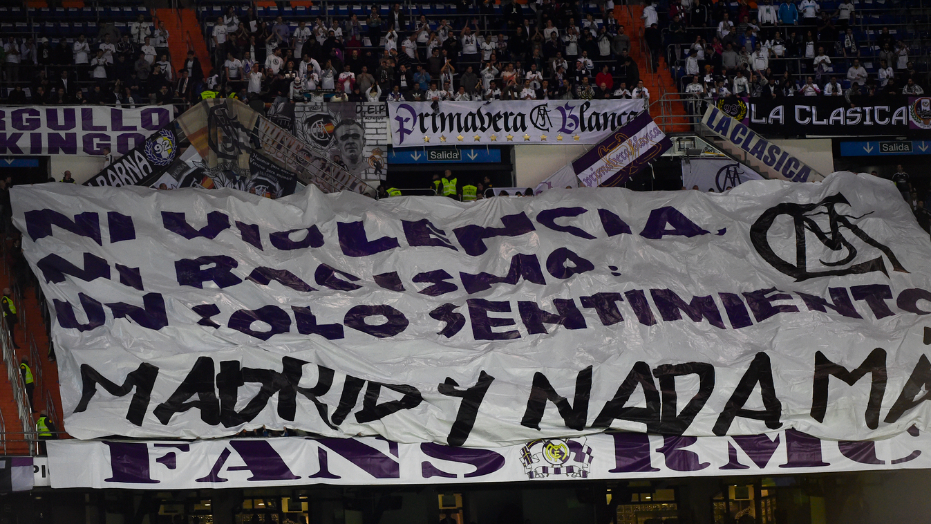 Supporters display a banner reading "No violence, nor racism, only one feeling: Madrid and nothing else" during the Spanish Copa del Rey (King's Cup) round of 32 second leg football match Real Madrid CF vs UE Cornella at the Santiago Bernabeu stadium in M