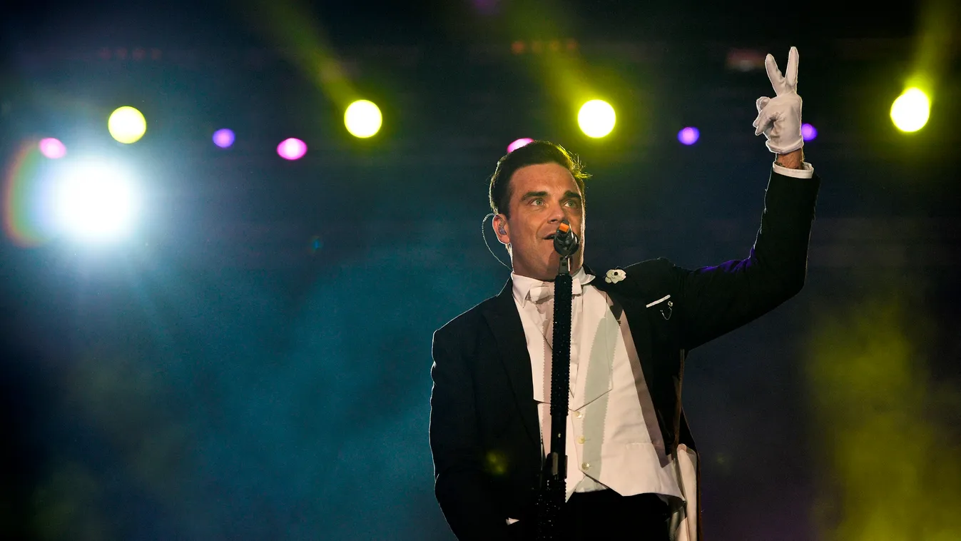 British singer Robbie Williams performs at the Rock in Rio Lisboa music festival at Bela Vista Park in Lisbon on May 25, 2014. Rock in Rio runs from May 25 to June 1, 2014.  AFP PHOTO / PATRICIA DE MELO MOREIRA 