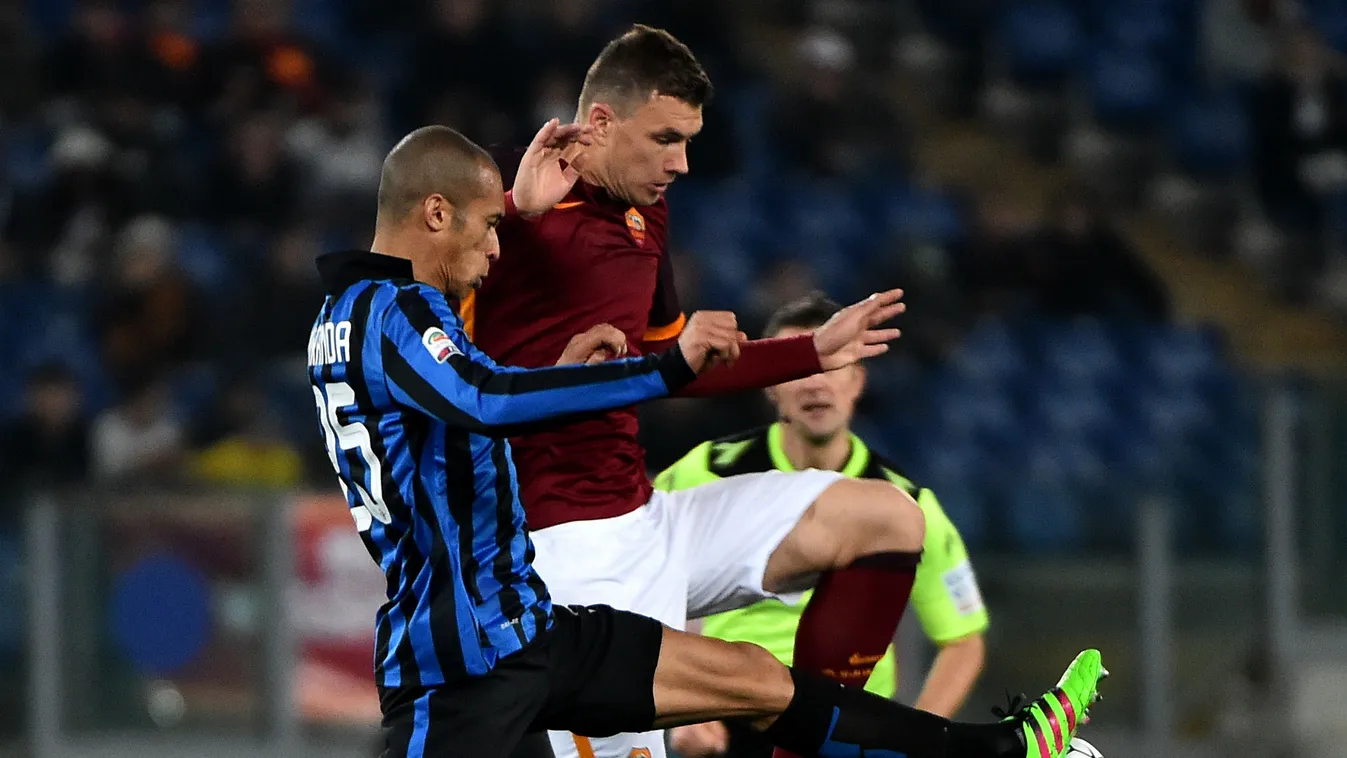 Inter Milan's defender from Brazil Joao Miranda vies with Roma's forward from Bosnia-Herzegovina Edin Dzeko 
