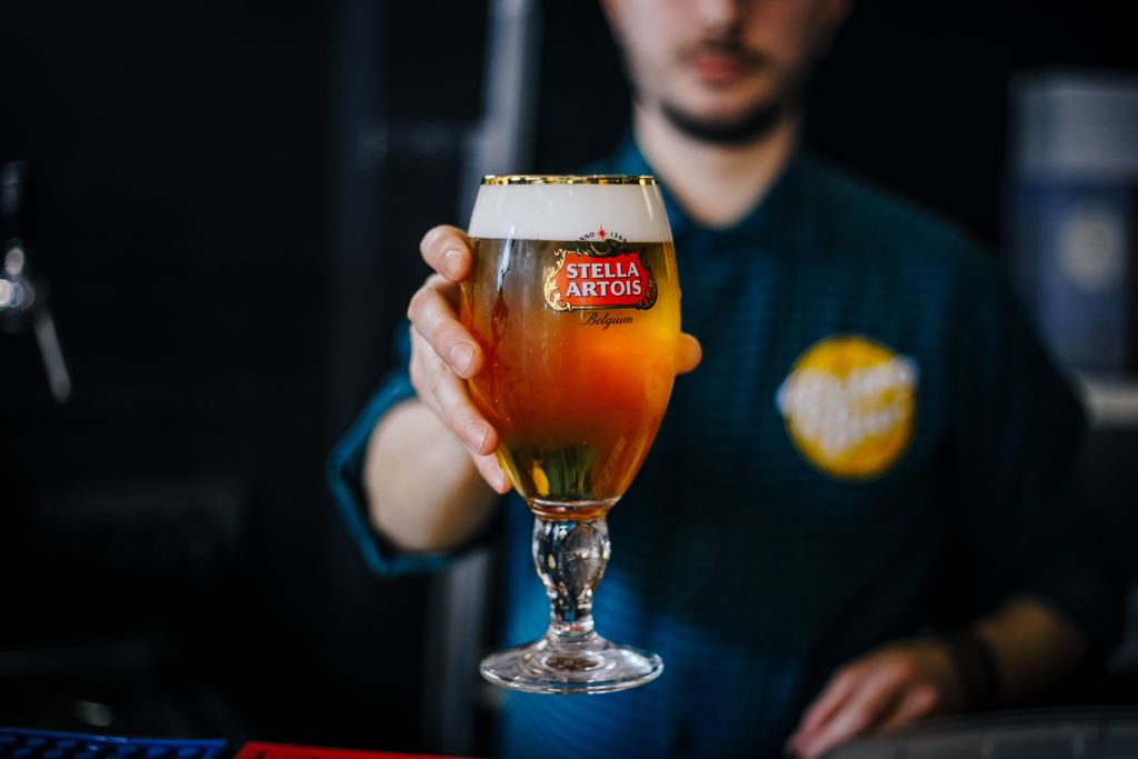 Draft,Stella,Artois,Light,Beer,In,A,Glass.,Pouring,Beer. 
