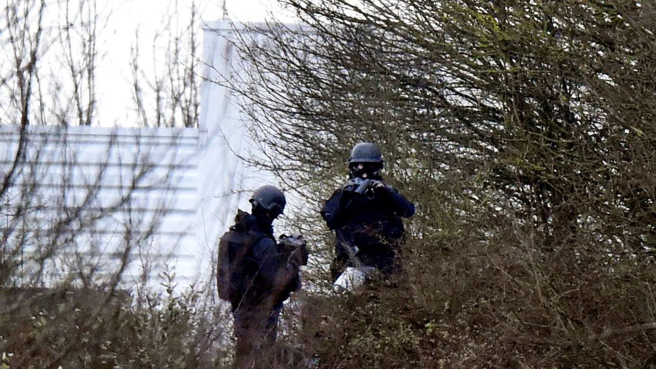 French police officers patrol in Dammartin-en-Goele where two brothers suspected of slaughtering 12 people in an Islamist attack on French satirical newspaper Charlie Hebdo held one person hostage as police cornered the gunmen, on January 9, 2015. The hos