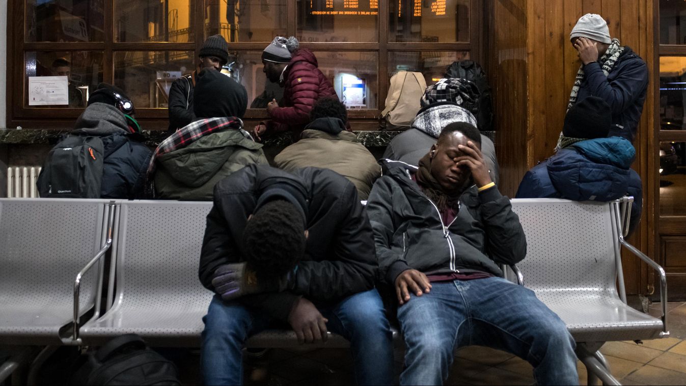migration social politics Horizontal Migrants rest in the waiting hall of the train station in Bardonecchia, Italy on January 13, 2018.  
Migrants are now trying to reach France crossing the Italian Alps by the snow-covered pass Colle della Scala (Col de 