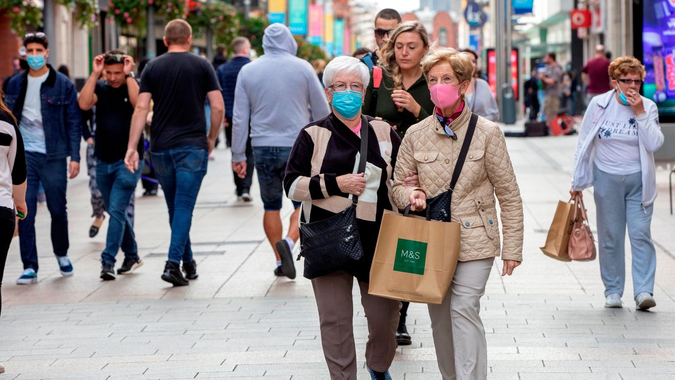 pandemic virus disease Horizontal CORONAVIRUS COVID-19 LOCKDOWN PROTECTIVE MASK Pedestrians and shoppers, some wearing face masks or coverings due to the COVID-19 pandemic, walk past shops in Dublin on September 18, 2020, following reports that further lo