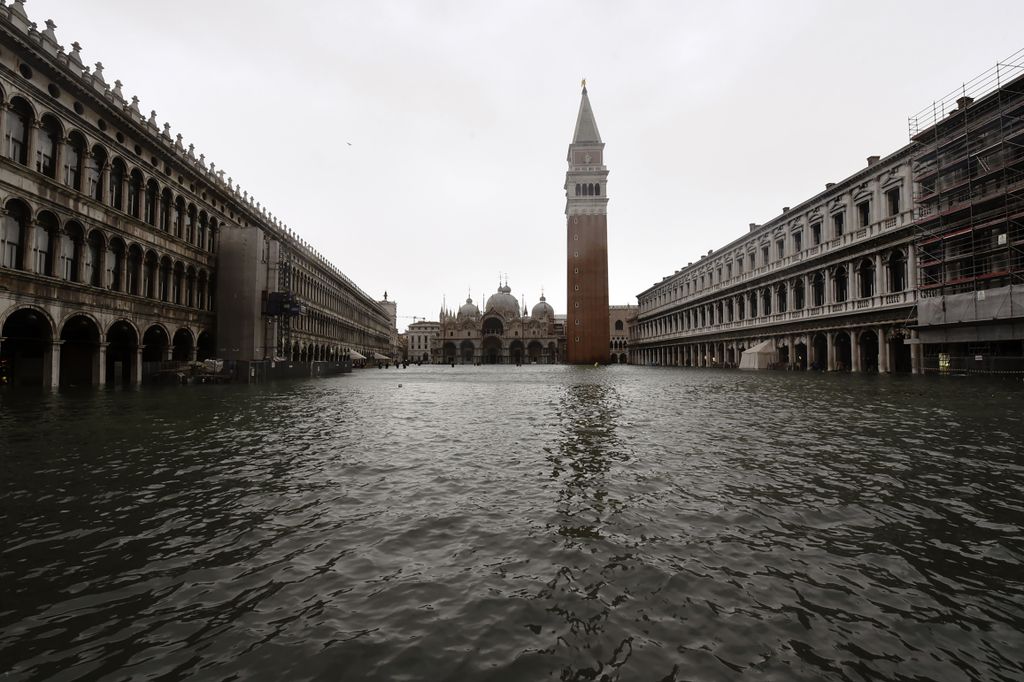 A picture taken on October 29, 2018 shows the flooded St. Mark's Square during a high-water (Acqua Alta) alert in Venice. - The flooding, caused by a convergence of high tides and a strong Sirocco wind, reached around 150 centimetres on October 29. (Photo