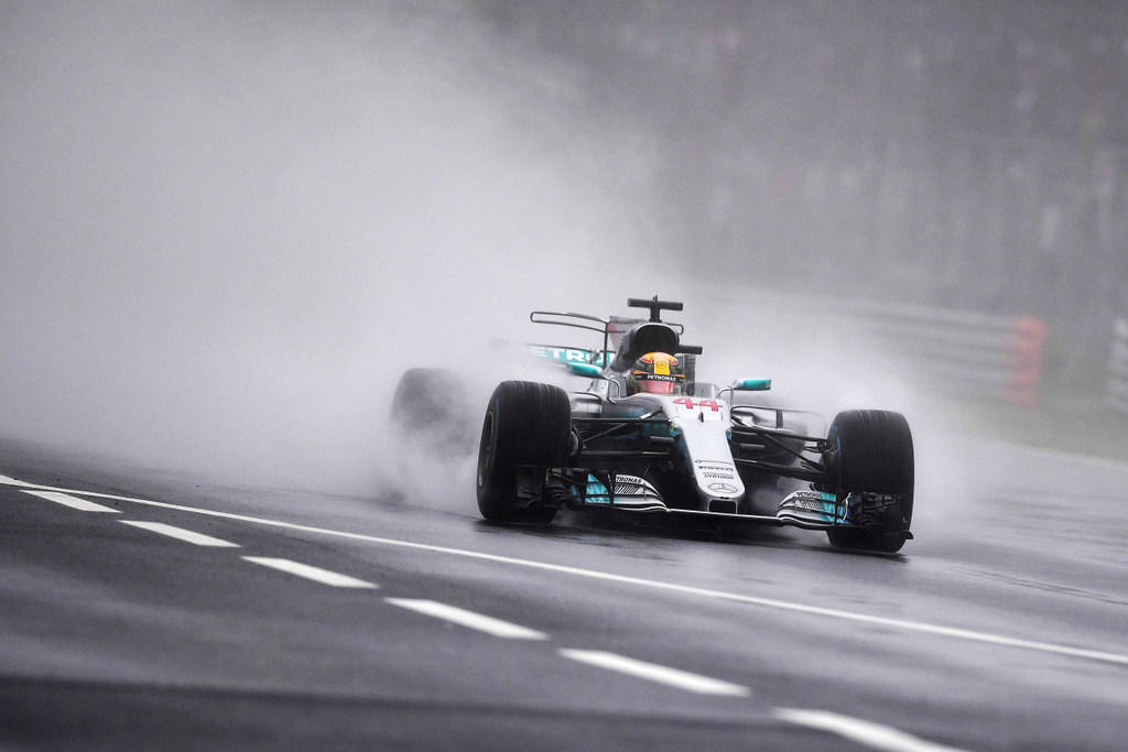 TOPSHOTS Horizontal F1 GRAND PRIX RAIN BAD WEATHER Mercedes' British driver Lewis Hamilton competes to win the pole position during the qualifying session at the Autodromo Nazionale circuit in Monza on September 2, 2017 ahead of the Italian Formula One Gr