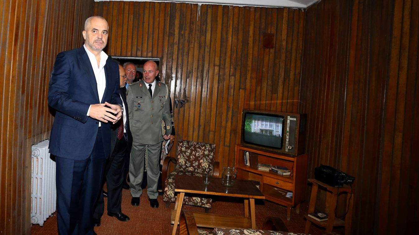 Albanian Prime Minister Edi Rama (L) visits a bunker built by late communist dictator Enver Hoxha in Tirana on November 22, 2014. A gigantic, secret underground bunker that Albania's communist regime built in the 1970s to survive a nuclear attack by the S