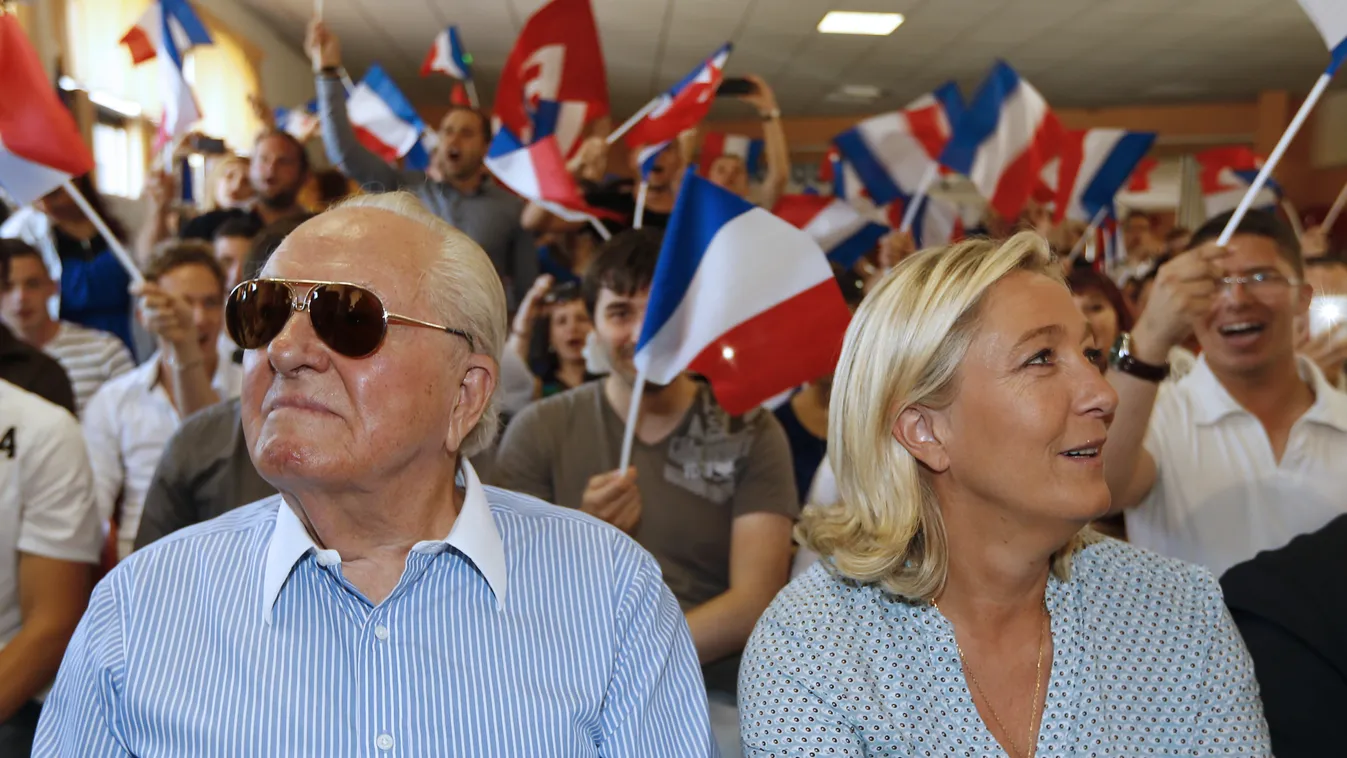 HORIZONTAL FN POLITICAL PARTY EXTREME RIGHT PARTY POLITICAL PARTY SUMMER SEMINAR NATIONAL FLAG POLITICAL ACTIVIST POLITICAL SUPPORTER PRESIDENT OF POLITICAL PARTY WOMAN POLITICIAN PERSON-POLITICS FATHER FAMILY BUST SUNGLASSES THREE-QUARTER FACE FLAG Frenc