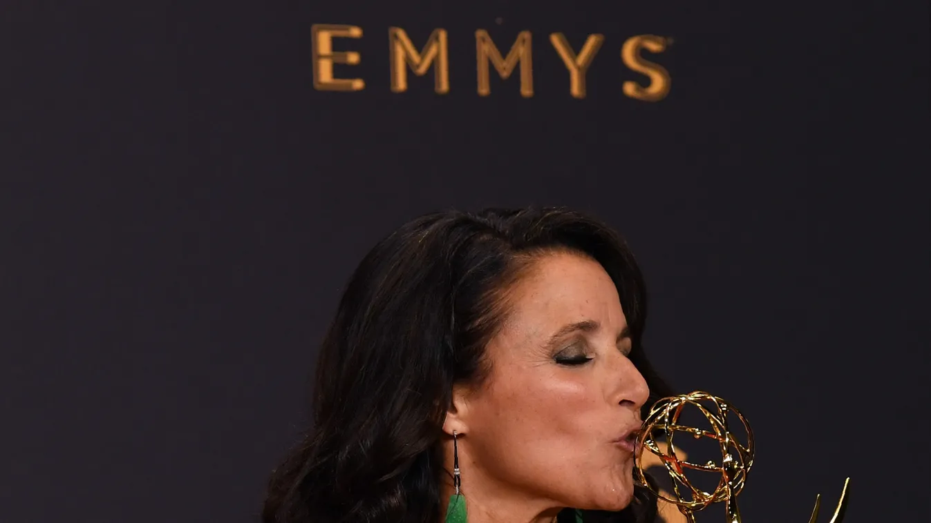 69th Emmy Awards  Vertical TELEVISION CEREMONY PRIZEGIVING ACTRESS AMERICAN SHOT TROPHY KISSING 