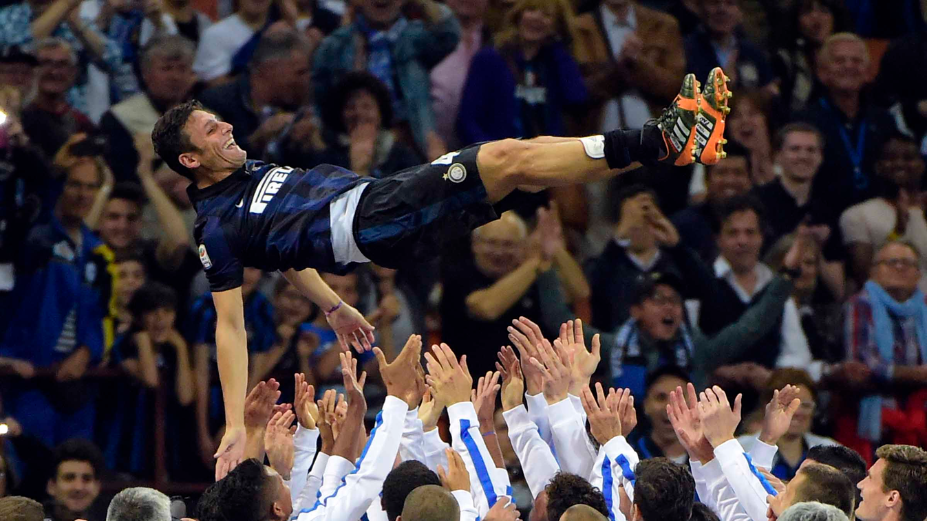 Inter Milan's Argentinian defender Javier Zanetti is celebrated by teammates after the Italian seria A football match Inter Milan vs Lazio, on May 10, 2014, in San Siro Stadium In Milan. Javier Zanetti celebrates his last match at the San Siro stadium aft
