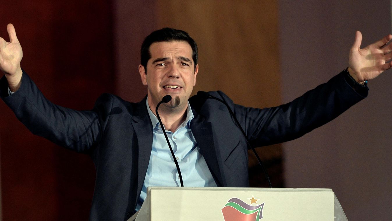 Syriza leader Alexis Tsipras greets supporters following victory in the election in Athens on January 25, 2015. Greek Prime Minister Antonis Samaras said the nation "had spoken" in handing victory to the anti-austerity Syriza party, and said he hoped the 