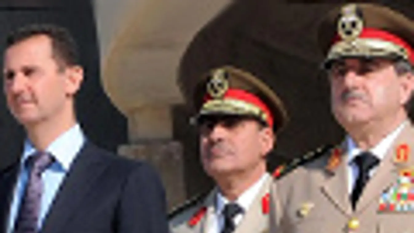 Bashar Asszád szíriai elnök és Daúd Radzsha védelmi miniszter, utóbbi merénylet áldozata lett, harcok Damaszkuszban
