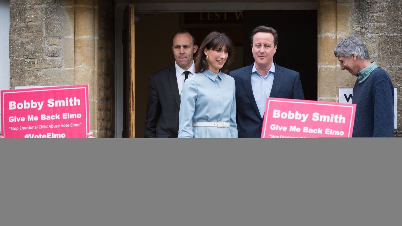 David Cameron brit miniszterelnök, a Konzervatív Párt vezetője  és felesége, Samantha, miután leadták szavazatukat egy spelsbury-i szavazóhelyiségben  a brit parlamenti választások napján. 