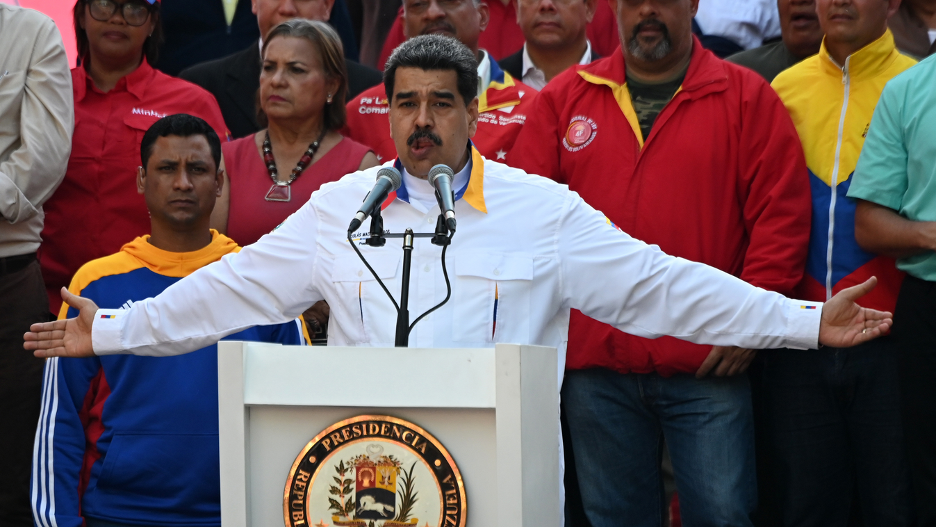 Horizontal Venezuela's President Nicolas Maduro gestures as he speaks during a rally in front of Miraflores Presidential Palace in Caracas on May 20, 2019. - Embattled Venezuelan President Nicolas Maduro rallied hundreds of his supporters in Caracas on Mo